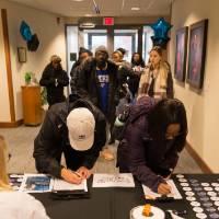 Image of students signing in to  National First Gen Day event